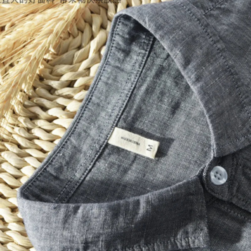close-up grey cotton linen shirt collar, button and fabric